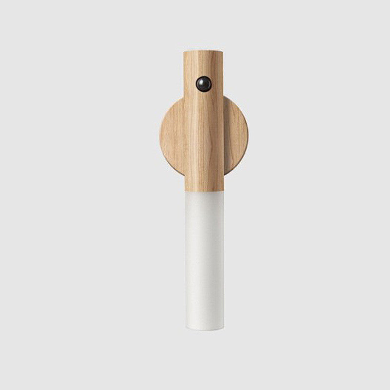 Magnetic wood motion-sensor LED night light with a cylindrical white diffuser and natural light wood finish.