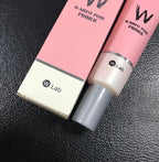 W.Lab W-Airfit Pore Primer box and tube. Pink and white packaging with grey cap on a black textured surface.
