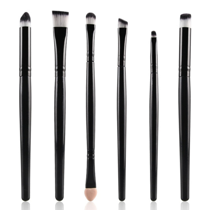 Six-piece makeup brush set with black handles and white-tipped synthetic bristles against a white background.