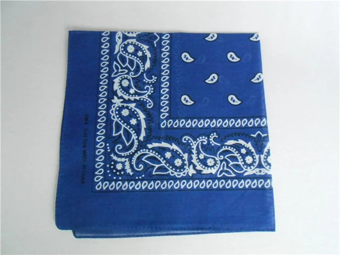 Blue square bandana with white paisley and cashew flower patterns, made of cotton.