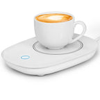 White electric mug warmer with a latte-filled white cup and a glowing blue power button on an oval base.