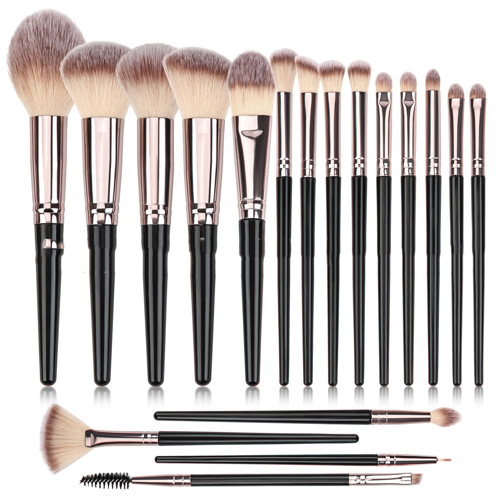 A set of makeup brushes with black handles, rose-gold ferrules, and soft, two-toned synthetic bristles.