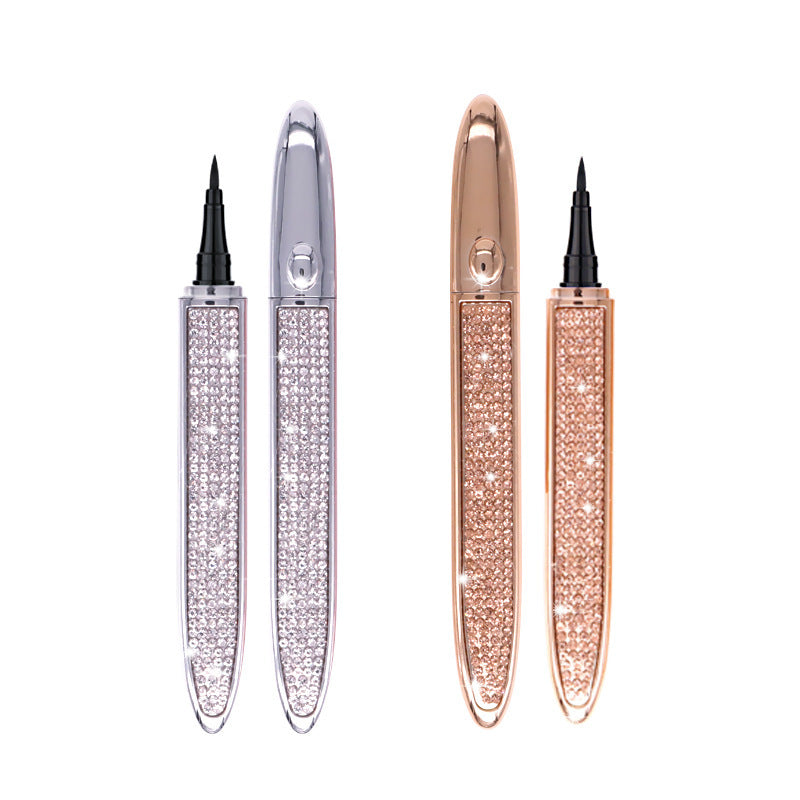 Two self-adhesive liquid eyeliner pens in silver and rose gold, decorated with sparkling crystals on a white background.