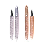 Two self-adhesive liquid eyeliner pens in silver and rose gold, decorated with sparkling crystals on a white background.