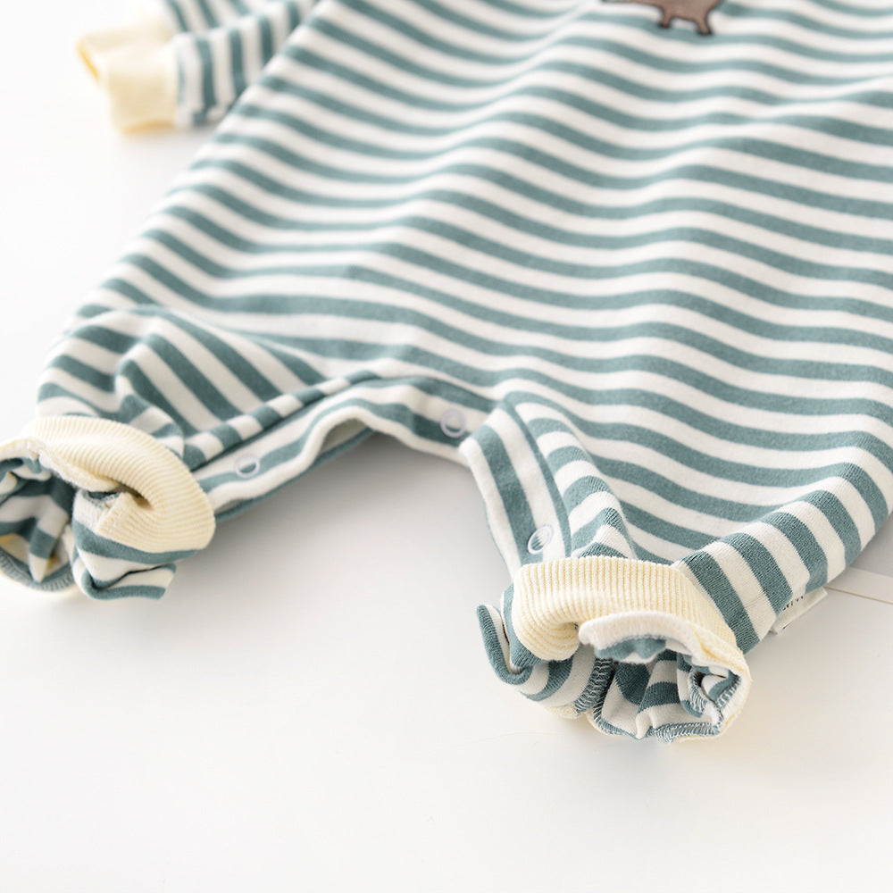 Baby jumpsuit with white and sage green stripes, ribbed cream cuffs, and snap buttons along the inner legs.