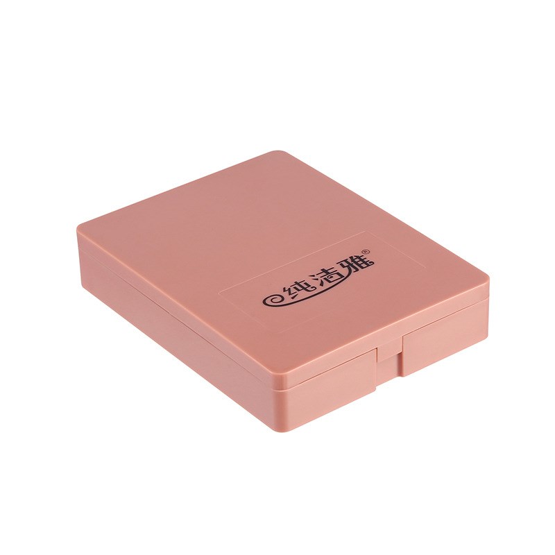 A dusty pink rectangular plastic makeup brush set case with black brand text on the lid, isolated on white.