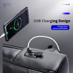 Black textured leather backpack with an integrated USB charging port connected to a smartphone.