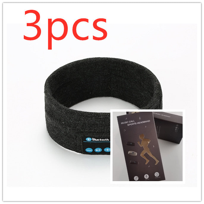 Three dark grey fabric Bluetooth sports headbands with integrated control panels and matching retail packaging.