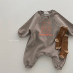 Taupe baby jumpsuit with long sleeves, bear graphic, "How about you?" text in orange, and matching brown socks.