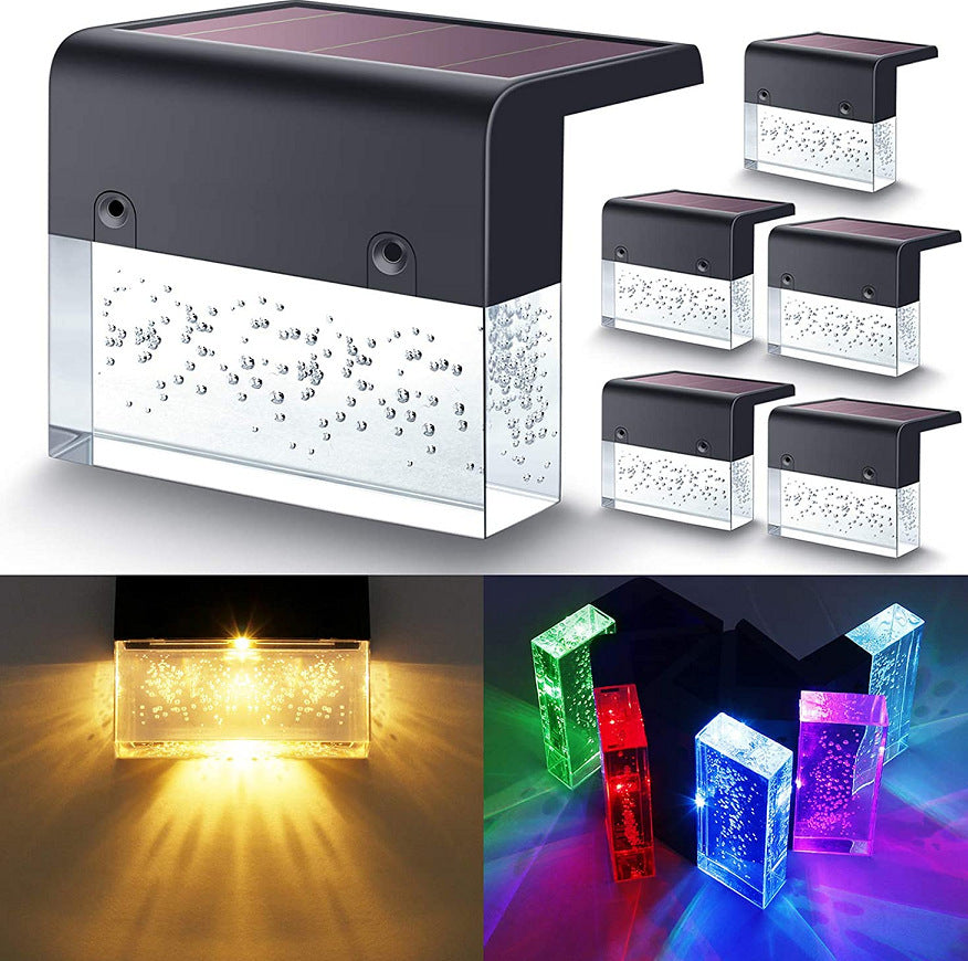Waterproof solar fence lights with black housing and clear bubble-glass lenses, featuring warm and RGB color modes.