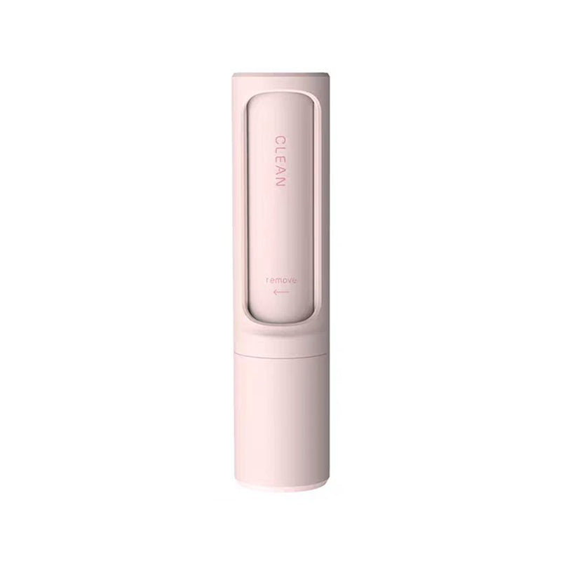 Light pink, cylindrical, self-cleaning lint roller for pet hair with "CLEAN" and "remove" labels on the casing.