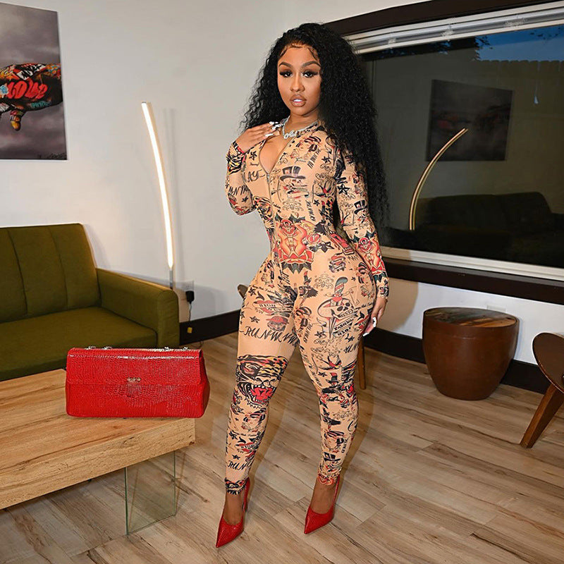 Woman wearing a slim-fit, tattoo-print long-sleeve sports jumpsuit with a front zipper, paired with red heels.