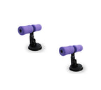 Two black metal sit-up bars with purple foam leg cushions and circular suction cup bases on a white background.