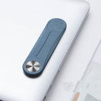 Blue aluminum alloy side-screen mount attached to a laptop lid, featuring a circular silver metallic pivot point.