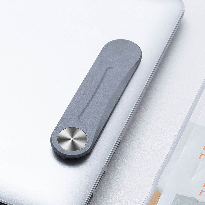 Grey aluminum alloy side screen mounting bracket attached to the back of a silver laptop.