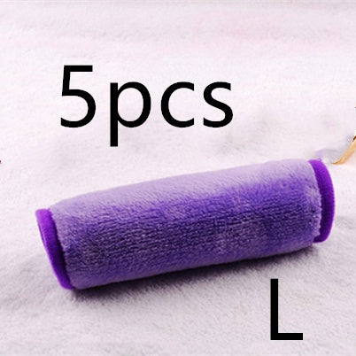 A rolled, soft, purple microfiber makeup remover towel. The image includes text indicating a 5-piece set.