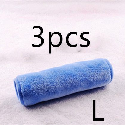 A blue, soft, plush microfiber makeup remover towel rolled up on a white fuzzy background, labeled "3pcs" and "L."