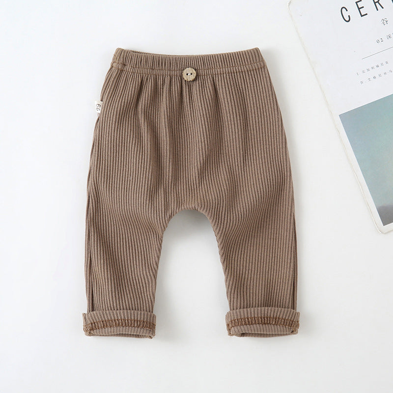 Brown ribbed baby leggings with an elastic waistband, decorative center button, and cuffed hems on a white background.