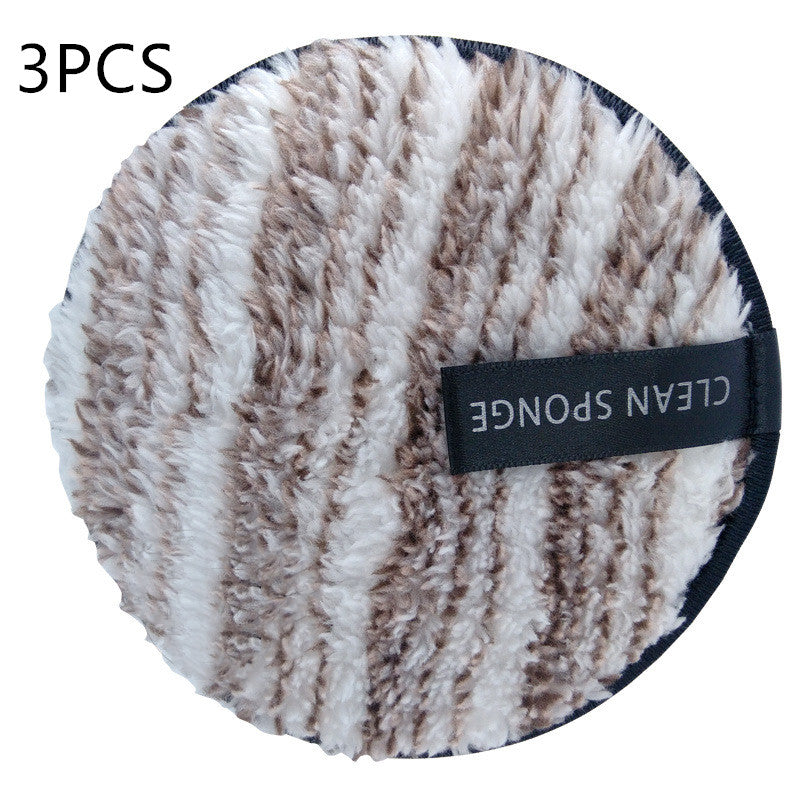 Round, white and brown striped fuzzy makeup puff with a black "CLEAN SPONGE" finger strap. Set of 3pcs.