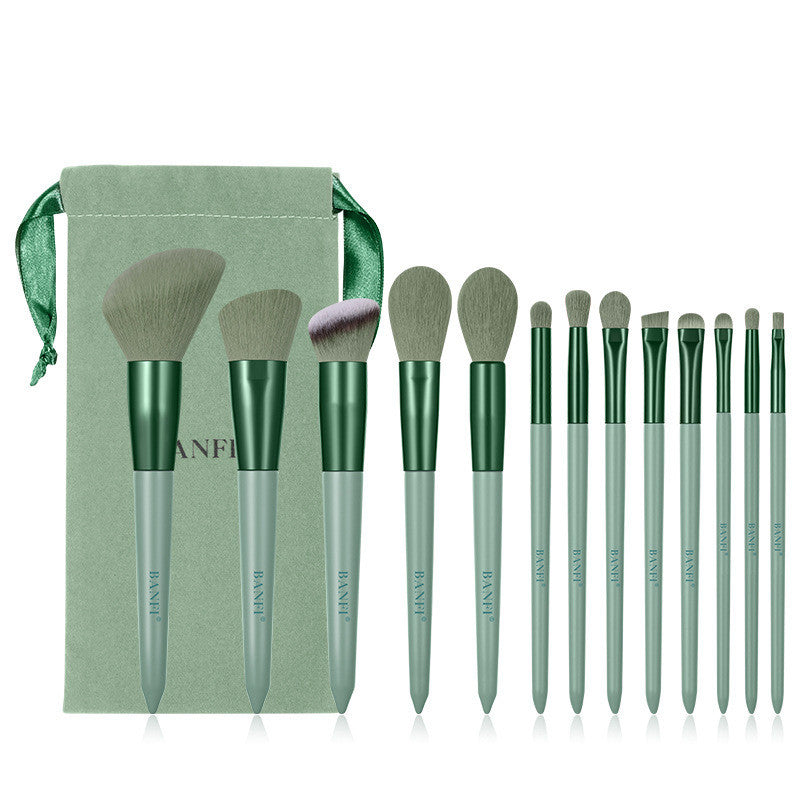 13-piece sage green makeup brush set with soft fiber bristles, matching drawstring pouch, and metallic handles.