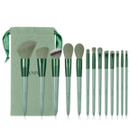 13-piece sage green makeup brush set with soft fiber bristles, matching drawstring pouch, and metallic handles.