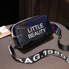 Black holographic cosmetic bag with "LITTLE BEAUTY" print and a branded "BAG 1980" adjustable shoulder strap.