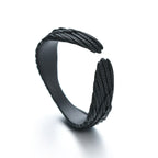 Matte black adjustable ring featuring intricate, textured angel wing detailing in a wrap-around hip hop style.
