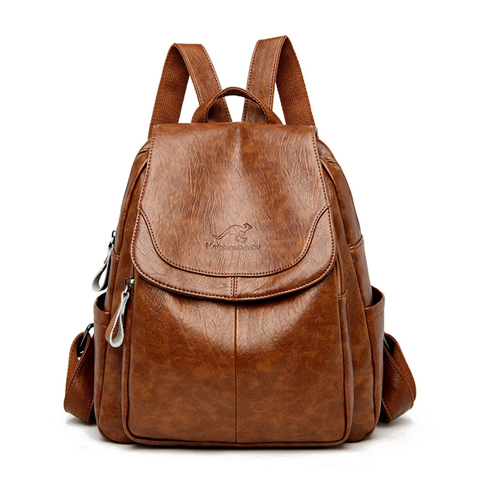 Brown soft leather women's backpack with kangaroo logo, flap top, zipper pockets, and adjustable shoulder straps.