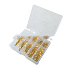 A clear, multi-compartment plastic box filled with various sizes of gold-colored barbed fishing hooks.