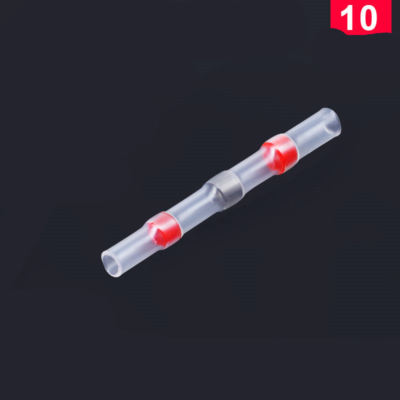 Clear heat-shrinkable wire connector with a center metal solder ring and red sealing rings at both ends.