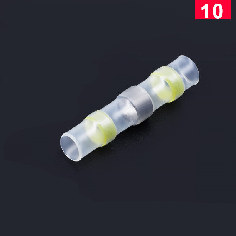 Clear heat-shrink solder butt connector with yellow waterproof rings on a black background, marked with a red "10".