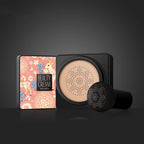 Venzen BB cream in a floral compact with a mushroom-head applicator on a black background.