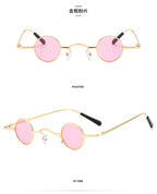 Retro-style sunglasses featuring small round pink lenses set in a thin gold metal frame with black temple tips.
