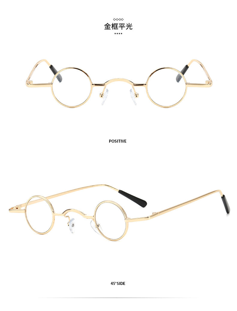 Retro gold-tone metal small round-frame glasses with clear lenses and black temple tips.