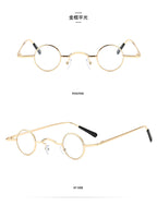 Retro gold-tone metal small round-frame glasses with clear lenses and black temple tips.