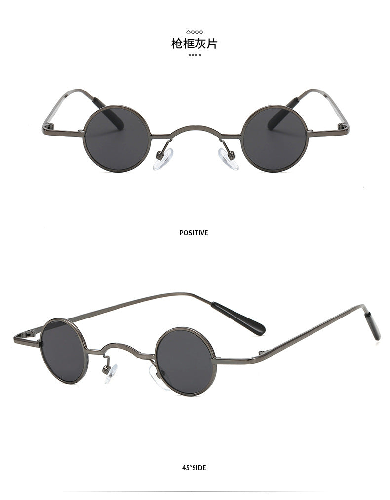 Small, round, retro metal-frame sunglasses in gunmetal grey with dark tinted lenses and adjustable nose pads.
