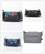 Four fabric baby stroller organizers in various colors and patterns with side cup holders and front flap closures.