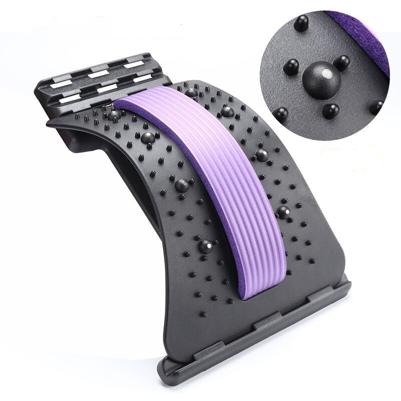 Black plastic lumbar back stretcher with a purple foam strip and acupressure massage nodes. Inset detail view included.