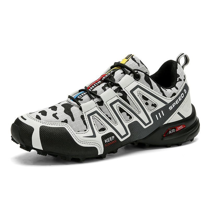 Men's grey and black camo hiking sneaker with a durable rubber sole, mesh upper, and lace-up design.