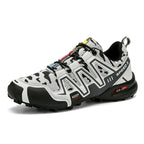Men's grey and black camo hiking sneaker with a durable rubber sole, mesh upper, and lace-up design.