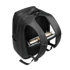 Black multifunctional backpack featuring a padded, open main compartment holding books against a white background.