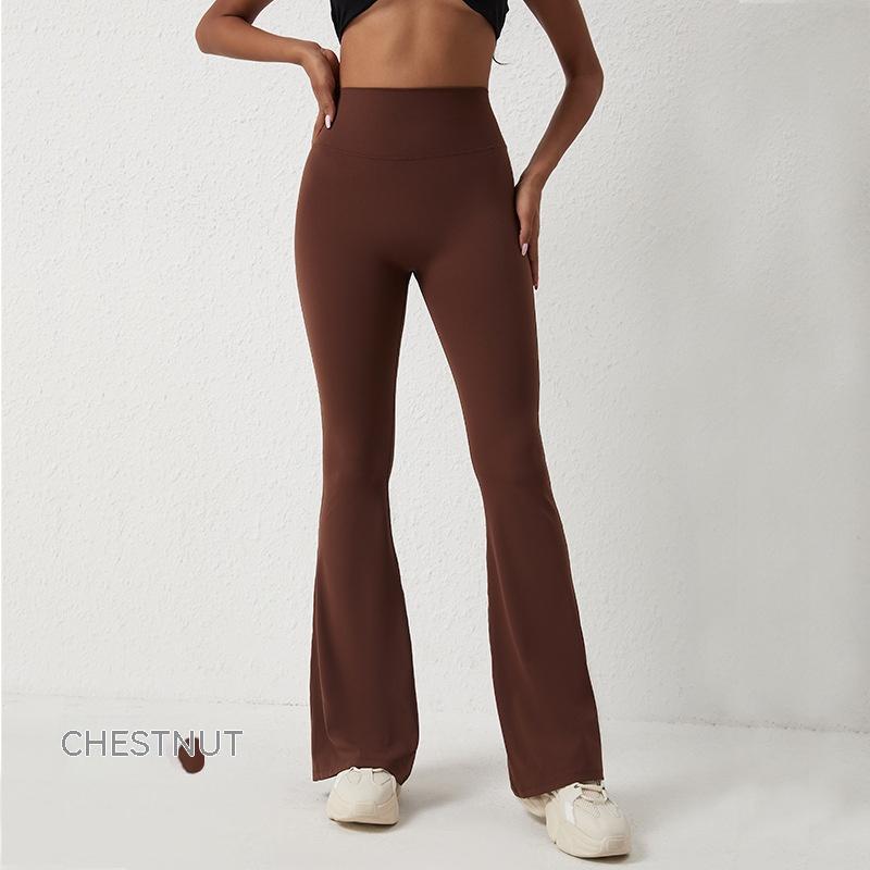A woman wearing high-waisted, chestnut brown, hip-lifting fitness pants with a flared, wide-leg design.