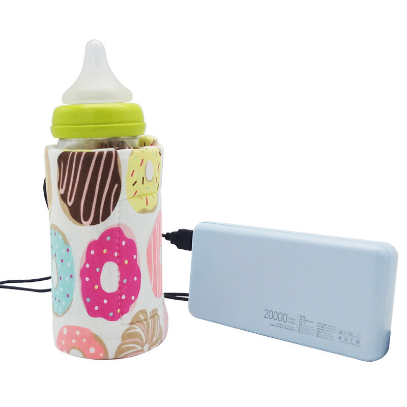 Donut-print portable USB baby bottle warmer sleeve connected to a light blue power bank, white background.