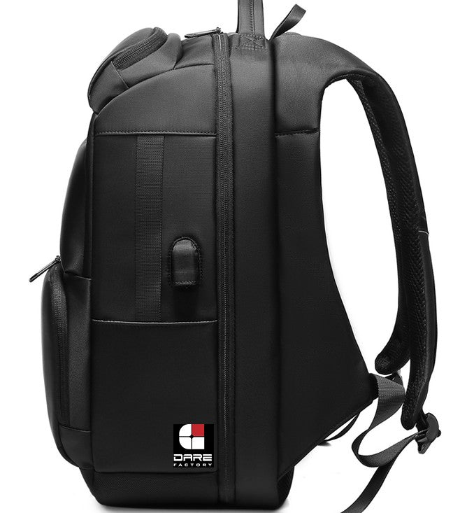 A black multifunctional backpack by Dare Factory, featuring a USB port, ergonomic straps, and durable, sleek material.