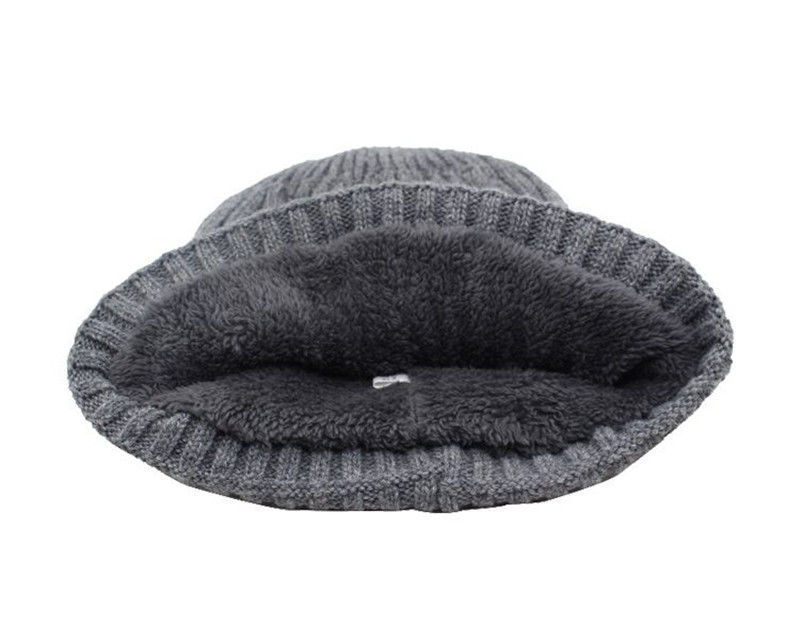Grey knitted beanie for men featuring a thick, soft, dark-grey fleece-lined interior for extra winter warmth.
