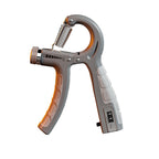 Gray adjustable hand grip strengthener with metallic spring, resistance dial, and digital counter on white background.