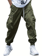 Olive green men's cargo joggers with a drawstring waist, large side pockets, and cuffed ankles on a white background.