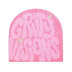 Pink knit hip hop beanie with bubble-letter "GRIT VISIONS" text and small star accents.