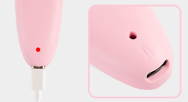 Pink Digitaldistribution375 makeup brush cleaner with a charging port and red indicator light for battery status.