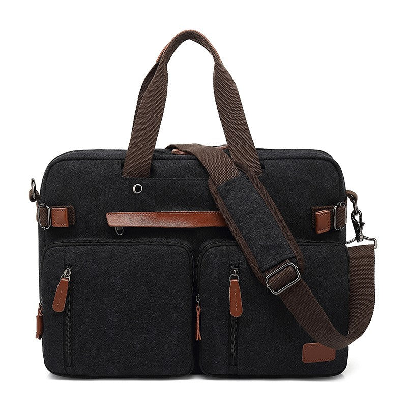 Black canvas multifunctional men's briefcase with brown leather accents, top handles, and a detachable shoulder strap.